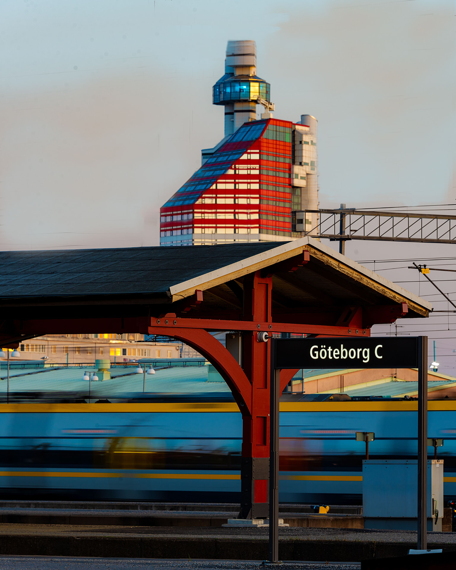 Göteborg C station platform with the city skyline behind